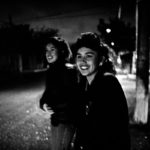 Two sisters, Patty & Cecilia, running to catch the bus to go to work in the early morning . Piedras Negras, Mx 1994.